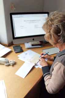 A Grant Cheque Being Prepared By The Gloucestershire Society's Welfare Committee